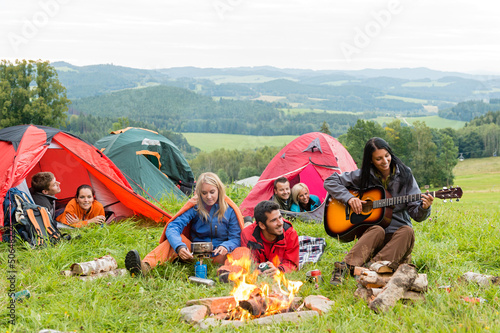 Photo: Camping students listening girl with guitar tents Camping students listening girl with guitar tents
