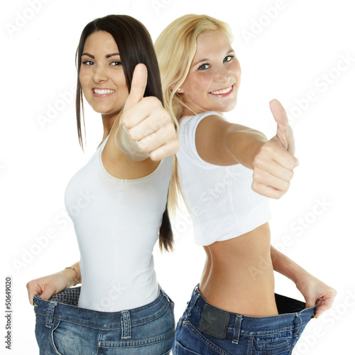 Photo: Beautiful girls are proud to lose weight - showing thumb up Beautiful girls are proud to lose weight - showing thumb up