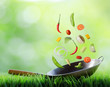 Fresh vegetables are falling in wok. Concept of cooking