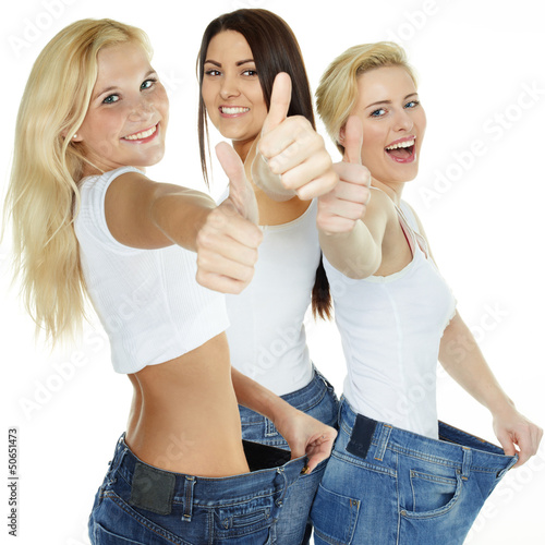 Photo: Beautiful girls are proud to lose weight - showing thumb up Beautiful girls are proud to lose weight - showing thumb up
