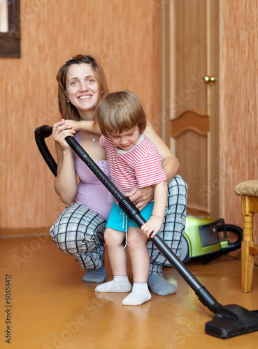 Photo: Family chores with vacuum cleaner Family chores with vacuum cleaner