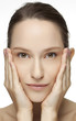 Beautiful young woman with clean skin of the face.