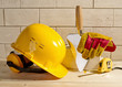 brick wall, helmet and trowel