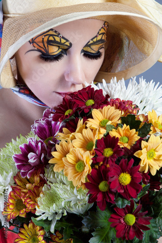 Photo: Woman with beautiful flowers Woman with beautiful flowers