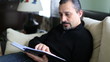 man reading book and turning page