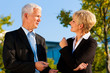 Business people talking outdoors