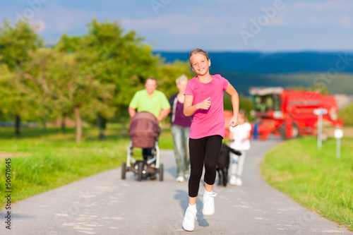 Photo: Family with children and dog having walk Family with children and dog having walk