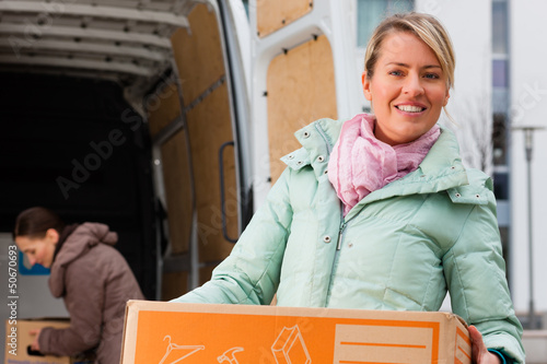 Photo: Female friends loading a moving truck Female friends loading a moving truck
