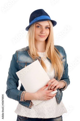 Photo: Young woman holding magazine Young woman holding magazine