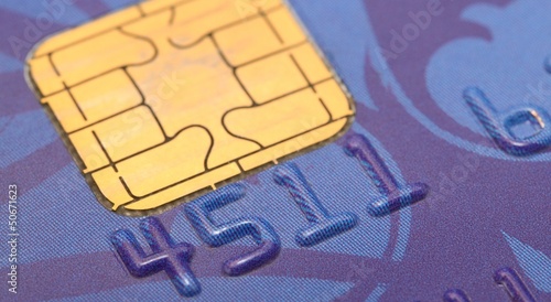 Photo: Macro shot of old blue bank card. Macro shot of old blue bank card.