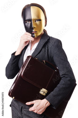 Photo: Woman with mask in hypocrisy concept Woman with mask in hypocrisy concept