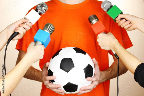 Photo: Conference meeting microphones and footballer Conference meeting microphones and footballer