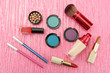 Decorative cosmetics on pink background