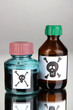 Deadly poison in bottles on grey background