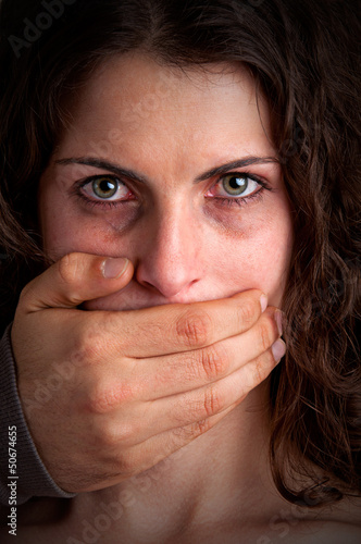 Photo: Woman Silenced by Aggressive Husband Woman Silenced by Aggressive Husband