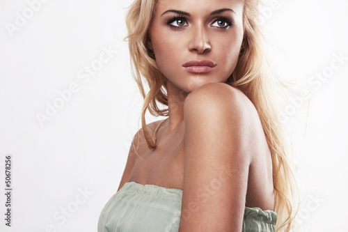 Photo: Close-up portrait of beauty blond woman in dress Close-up portrait of beauty blond woman in dress