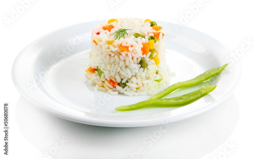 Photo: Delicious risotto with vegetables, isolated on white Delicious risotto with vegetables, isolated on white