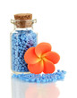 Little bottle full with colorful beads isolated on white