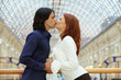 Young couple, kissing on bridge
