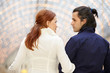 Man and woman look one each other, view from behind