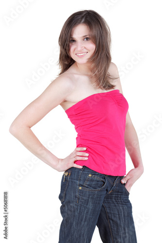 Photo: Young woman in blue jeans and in red blouse without shoulders Young woman in blue jeans and in red blouse without shoulders