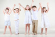 Four cute little girls and one boy in white clothes