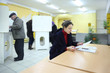 People casting ballots on elections to duma