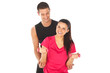 Woman with her personal fitness trainer exercising with weights