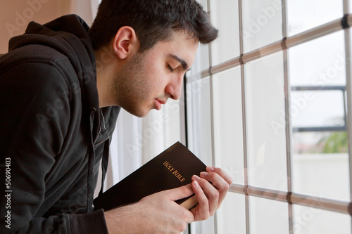 Photo: Man Praying by Window Man Praying by Window