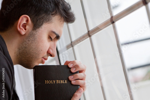 Photo: Man Praying by Window Man Praying by Window