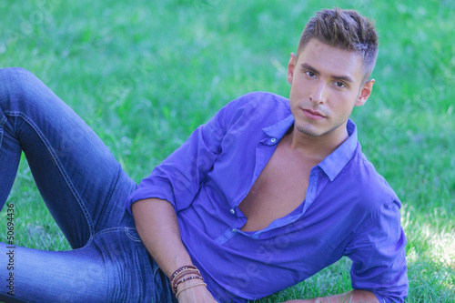 Photo: man resting in grass man resting in grass