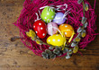 easter eggs in a nest on wooden background