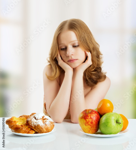 Photo: woman choose between healthy and unhealthy food woman choose between healthy and unhealthy food