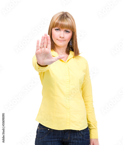 Photo: Serious woman making stop hand sign palm gesture Serious woman making stop hand sign palm gesture