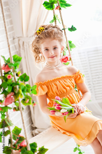 Photo: Portrait of a beautiful girl with tulips Portrait of a beautiful girl with tulips