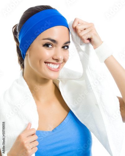 Photo: Cheerful woman in fitness wear with towel, over white Cheerful woman in fitness wear with towel, over white