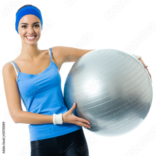 Photo: Cheerful smiling woman with fitball, over white Cheerful smiling woman with fitball, over white