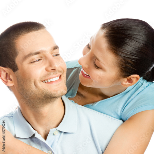 Photo: Happy smiling young couple, on white Happy smiling young couple, on white