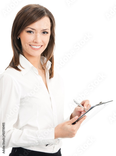 Photo: Happy businesswoman writing on clipboard Happy businesswoman writing on clipboard