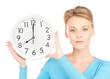 businesswoman with wall clock