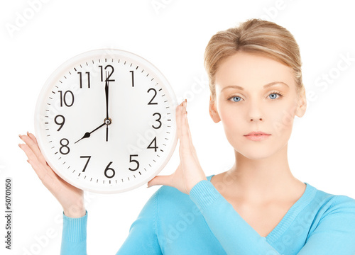 Photo: businesswoman with wall clock businesswoman with wall clock