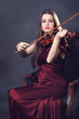 Photo: Beautiful girl playing a fiddle Beautiful girl playing a fiddle