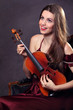 Photo: Funny girl playing with a violin Funny girl playing with a violin