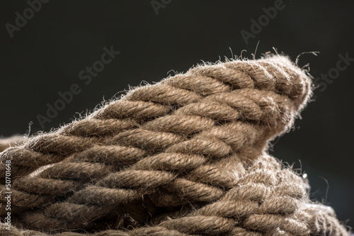 Photo: Hempen cord on a black background Hempen cord on a black background