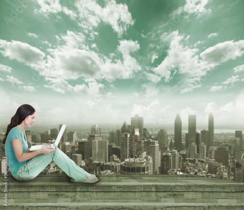 Photo: Young woman with laptop computer. Young woman with laptop computer.