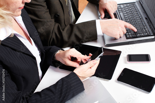 Photo: Business people group working with laptop. Business people group working with laptop.