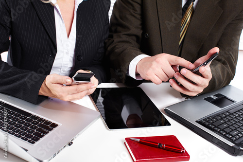 Photo: Business people group working with laptop. Business people group working with laptop.