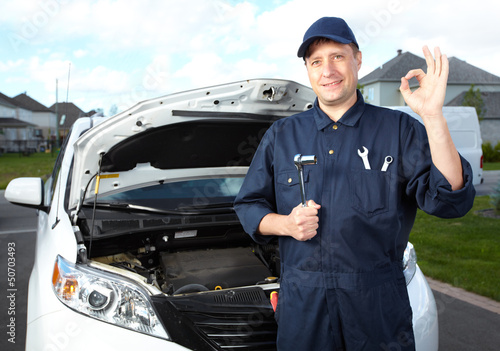 Photo: Professional auto mechanic. Professional auto mechanic.