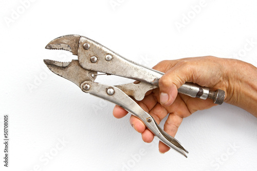 Photo: Holding monkey wrench in hand Holding monkey wrench in hand