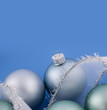 Christmas baubles on blue